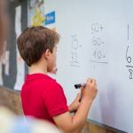 Boy Solving Math Problem