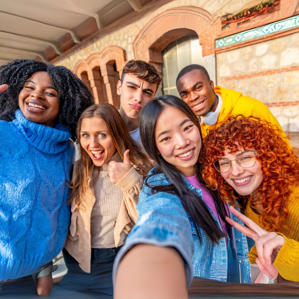 Cheerful Diverse Group of Friends Having Fun Taking Selfie While