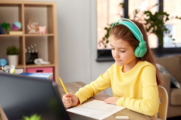 Student Girl Doing School Test at Home